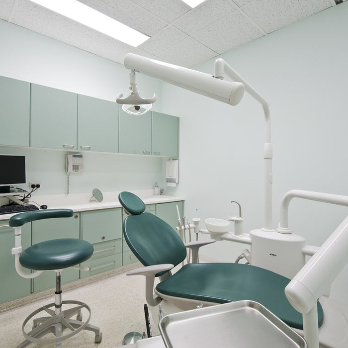 Dental chair in examining room at dental office